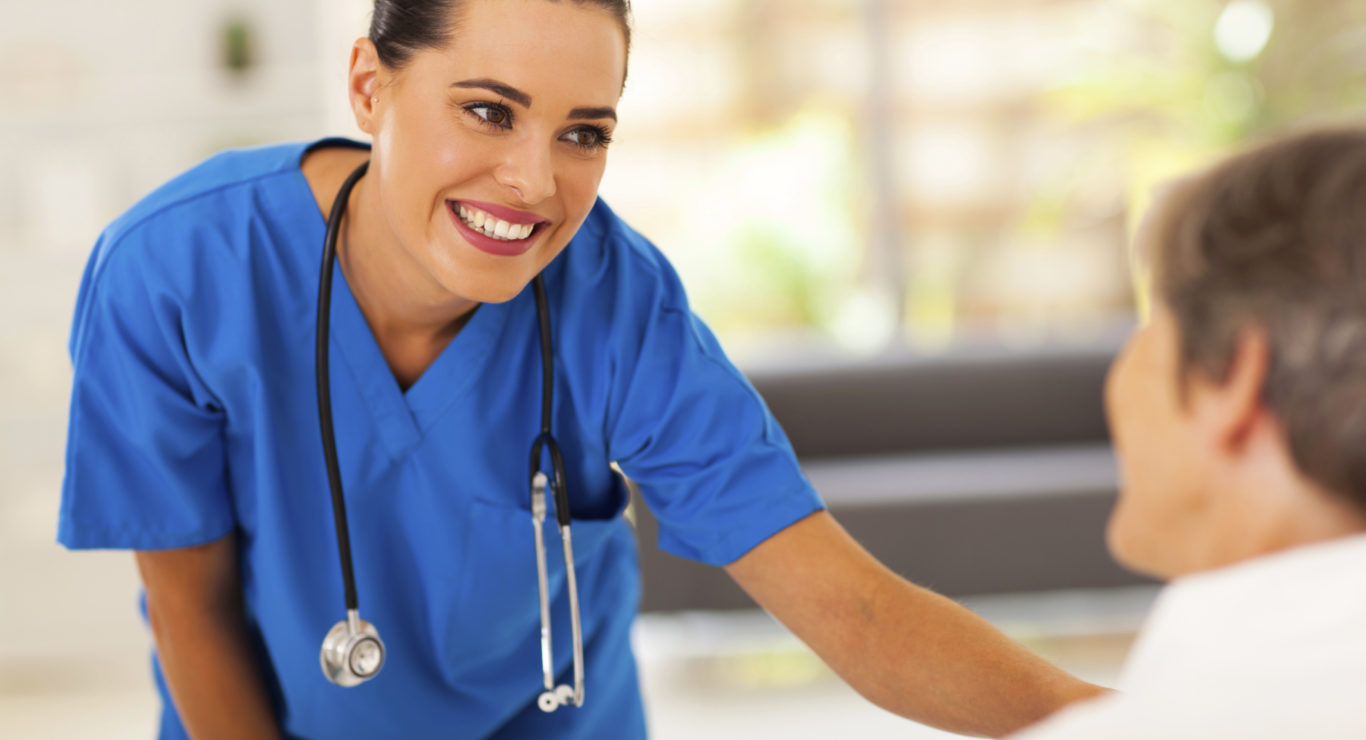 nurse-2 friendly young nurse talking to senior patient